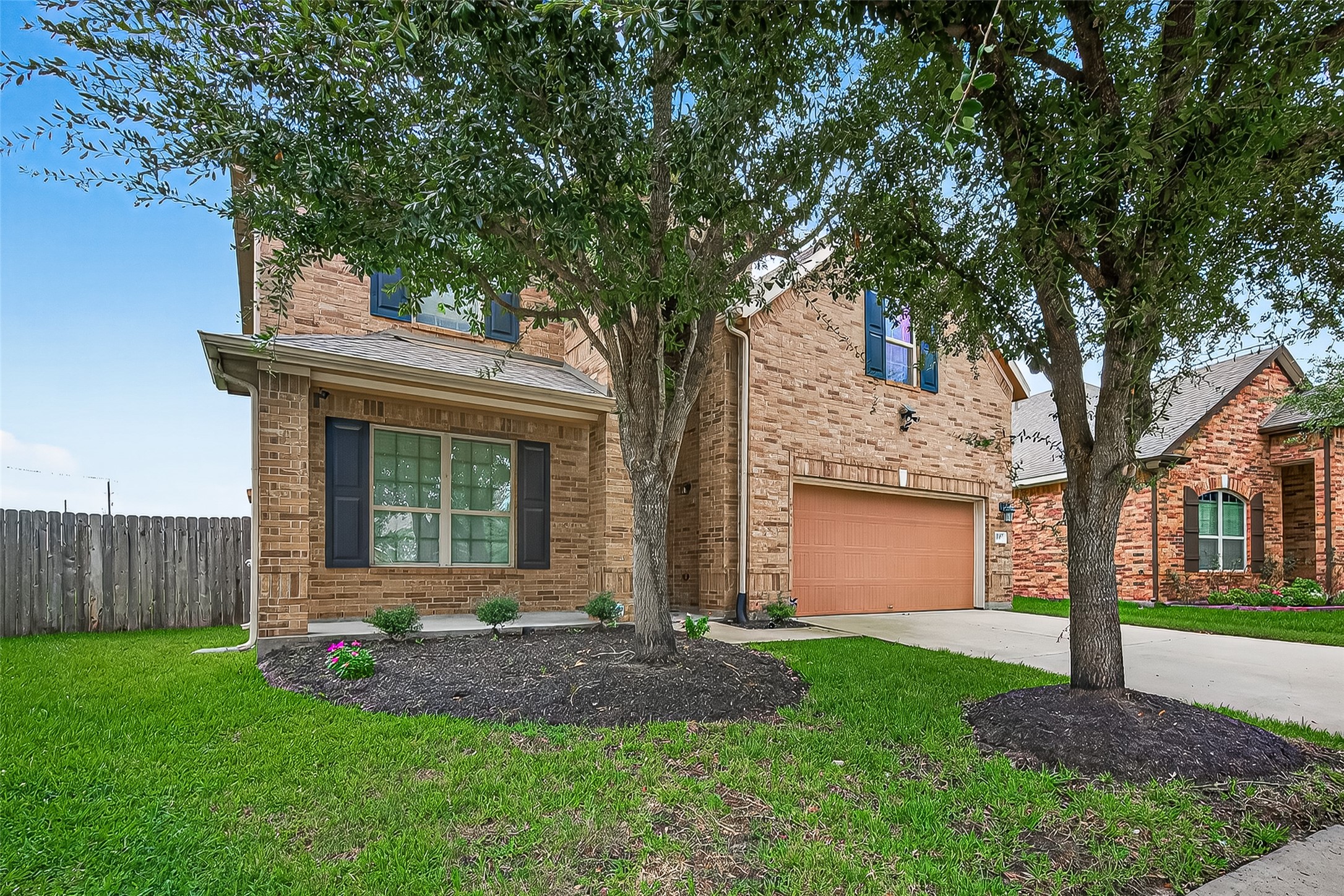 8107 Lockridge Terrace Lane Cypress, TX 77433 - Photo 4 of 50 Enjoy the convenience of an attached two-car garage, blending seamlessly with the home's classic design.