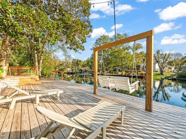 a view of sitting area with trees in front of it