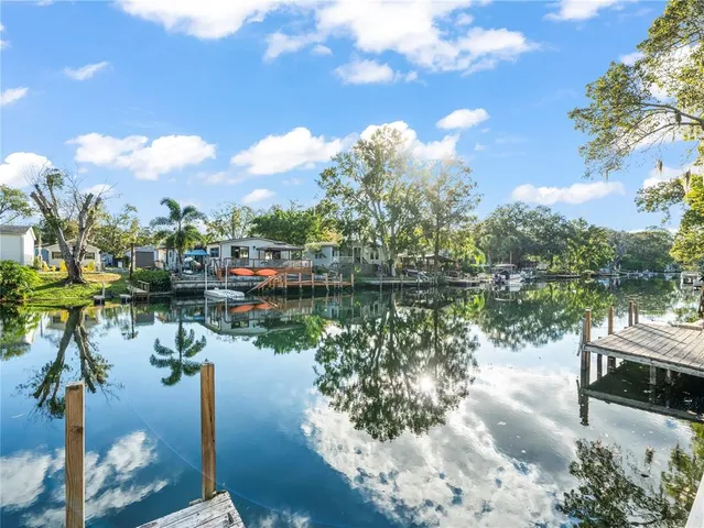 a view of a house with wooden fence