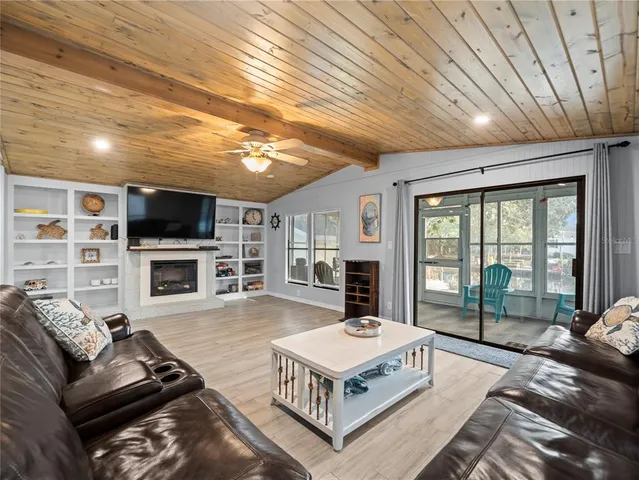 a kitchen with a sink a stove and chairs