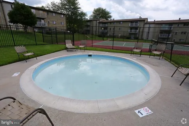 a view of a chairs and table in the patio