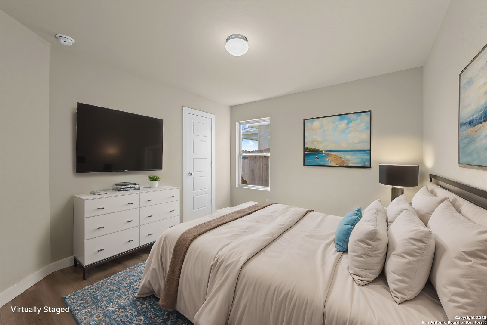 1177 Limestone Ridge Seguin, TX 78155 - Photo 10 of 40 a bedroom with a bed and a flat screen tv