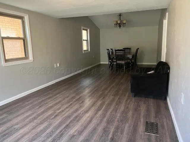 wooden floor in a livingroom with a window