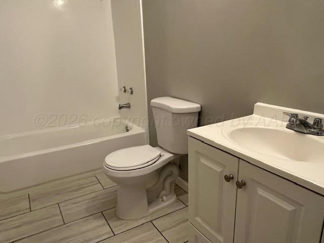 530 South Main Street Booker, TX 79005 - Photo 7 of 10 a white toilet sitting next to a bath tub