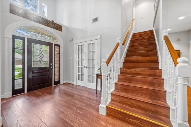a view of an entryway with wooden floor