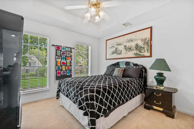 a bedroom with bed and a window