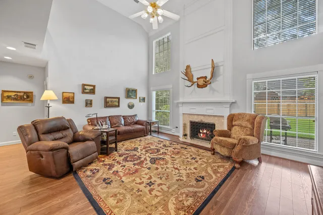 a living room with furniture fireplace and window