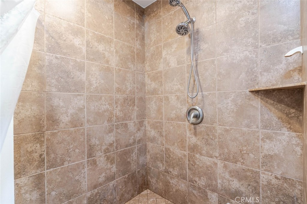 10434 Irma Avenue Tujunga, CA 91042 - Photo 13 of 29 a bathroom with a shower