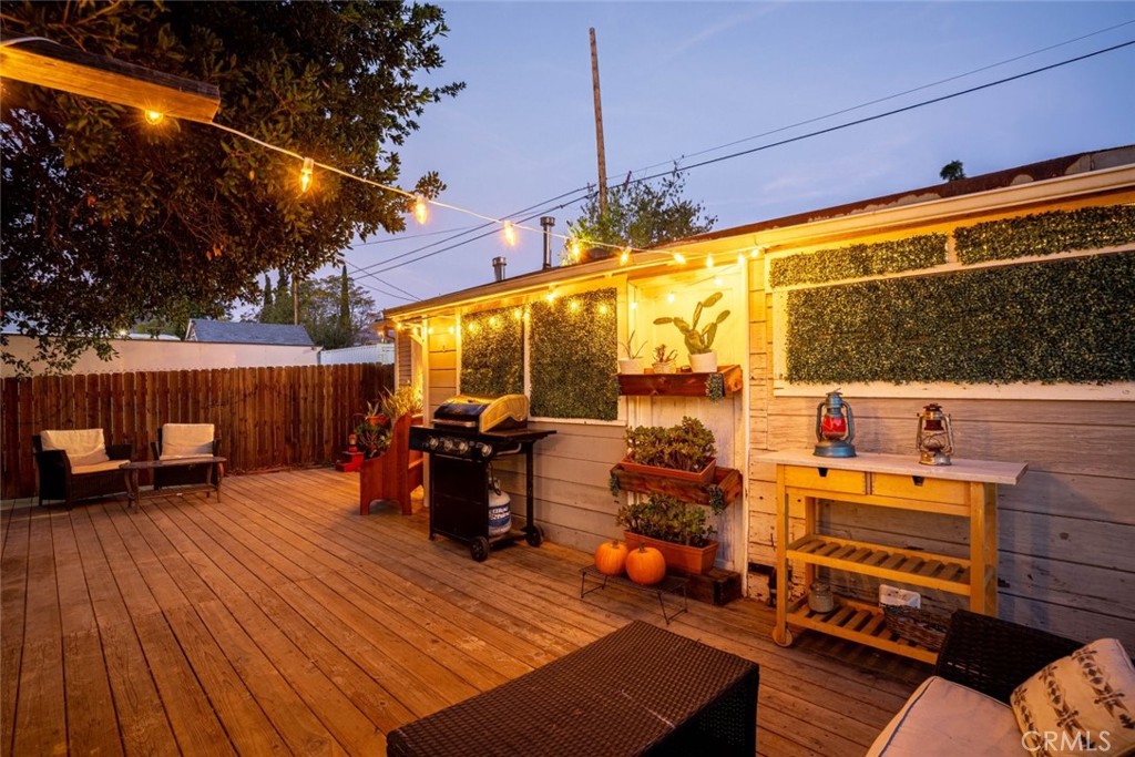 10434 Irma Avenue Tujunga, CA 91042 - Photo 16 of 29 a view of a chairs and tables in the back yard of the house