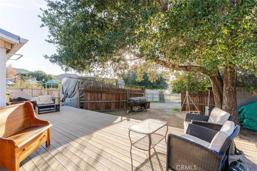 10434 Irma Avenue Tujunga, CA 91042 - Photo 24 of 29 a view of backyard with seating space and wooden fence