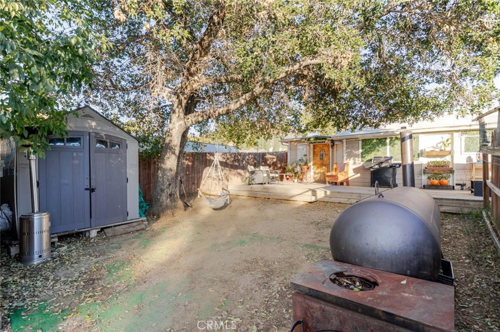 10434 Irma Avenue Tujunga, CA 91042 - Photo 25 of 29 a backyard of a house with table and chairs