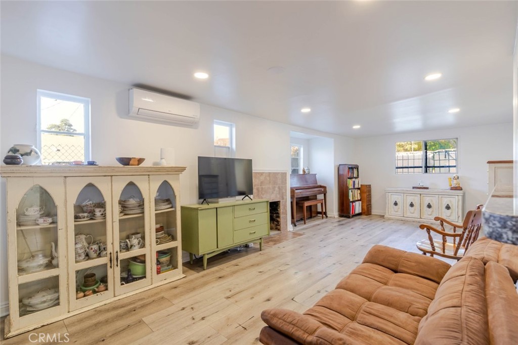 10434 Irma Avenue Tujunga, CA 91042 - Photo 7 of 29 a living room with furniture kitchen view and a flat screen tv
