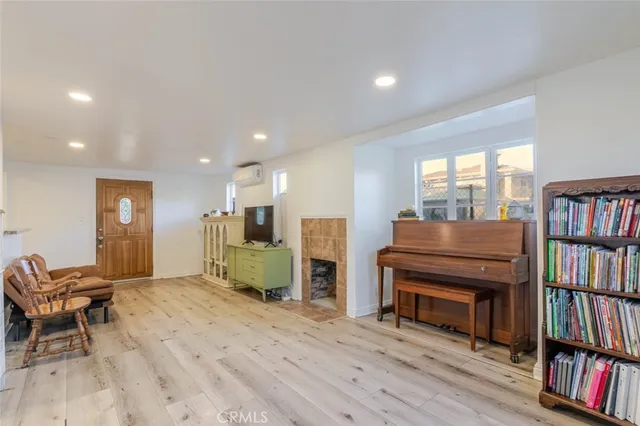 a living room with furniture and a book shelf
