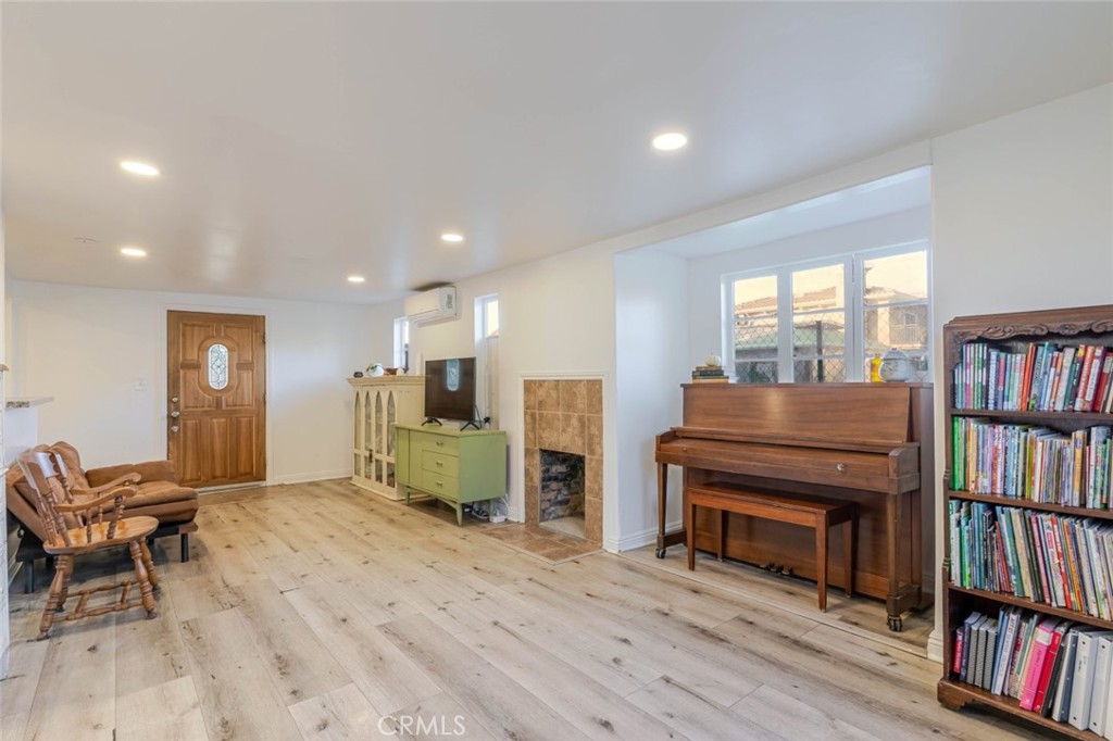 10434 Irma Avenue Tujunga, CA 91042 - Photo 8 of 29 a living room with furniture and a book shelf