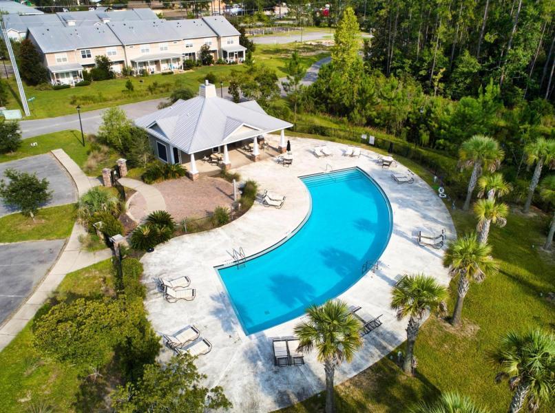 114 North Sand Palm Road, Unit 93VISTA Freeport, FL 32439 - Photo 28 of 32 an aerial view of a house with yard swimming pool and outdoor seating