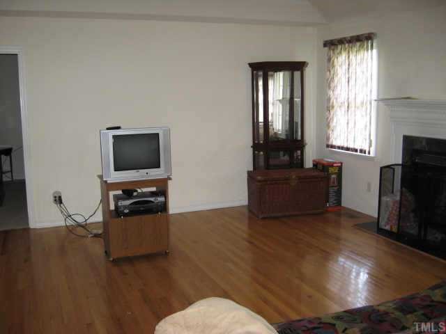 11113 North Radner Way Raleigh, NC 27613 - Photo 5 of 10 family room with hardwood floors