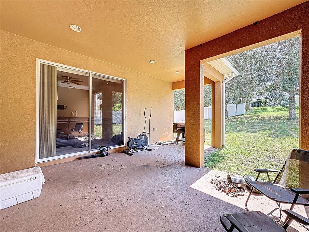 1692 Scrub Jay Road Apopka, FL 32703 - Photo 11 of 35 a view of a livingroom with furniture and floor to ceiling window