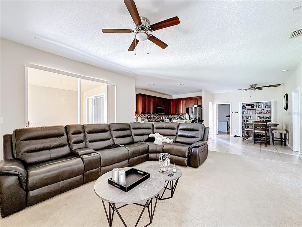 1692 Scrub Jay Road Apopka, FL 32703 - Photo 19 of 35 a living room with furniture and a large window