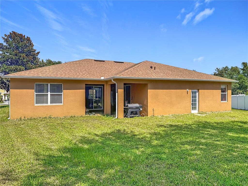 1692 Scrub Jay Road Apopka, FL 32703 - Photo 2 of 35 a front view of a house with a garden