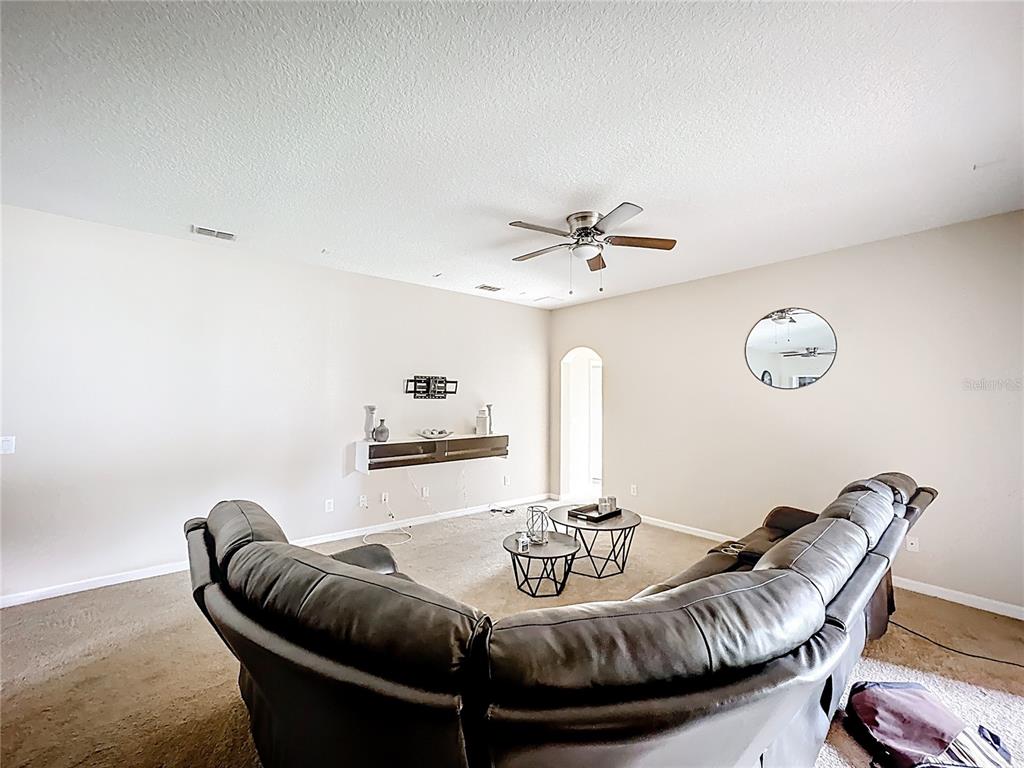 1692 Scrub Jay Road Apopka, FL 32703 - Photo 22 of 35 a view of a dining room with furniture