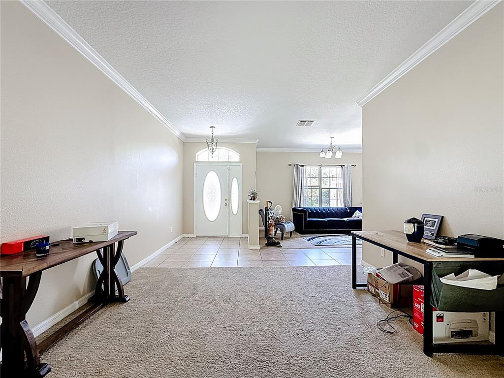 1692 Scrub Jay Road Apopka, FL 32703 - Photo 28 of 35 a room with furniture a air conditioner and a window