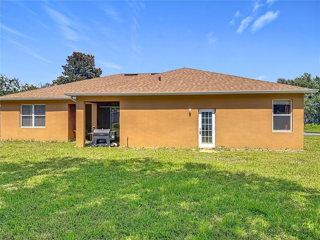 1692 Scrub Jay Road Apopka, FL 32703 - Photo 4 of 35 a house view with a garden space