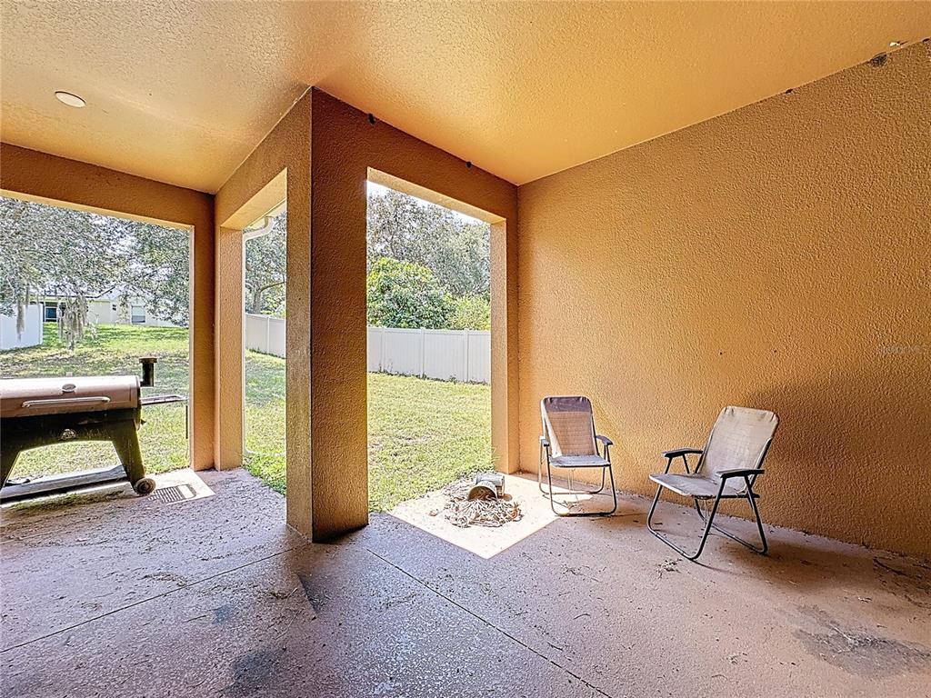 1692 Scrub Jay Road Apopka, FL 32703 - Photo 8 of 35 a living room with furniture and a window