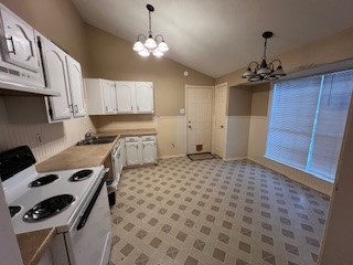 17407 Ranch Country Road Hockley, TX 77447 - Photo 2 of 14 a kitchen with a stove a sink and a refrigerator