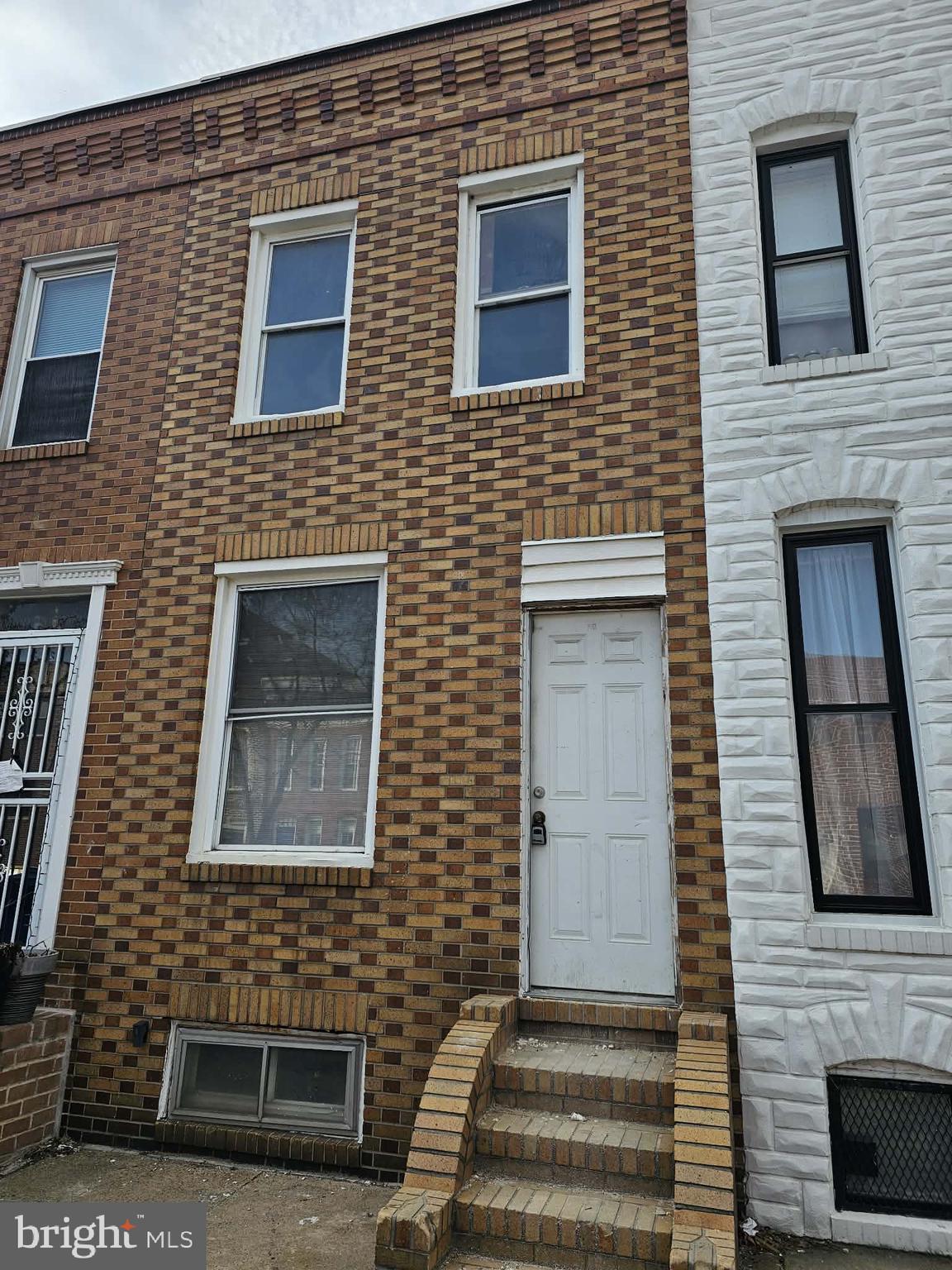 1158 Nanticoke Street Baltimore, MD 21230 - Photo 2 of 8 a front view of a building with brick walls