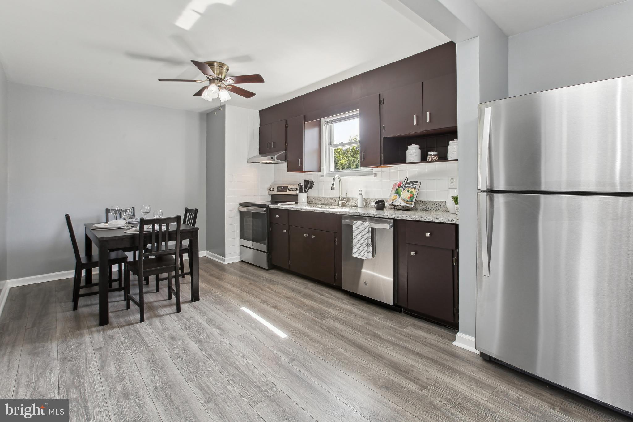 10711 Scaggsville Road Laurel, MD 20723 - Photo 8 of 34 Large sunlit kitchen with loads of cabinet space