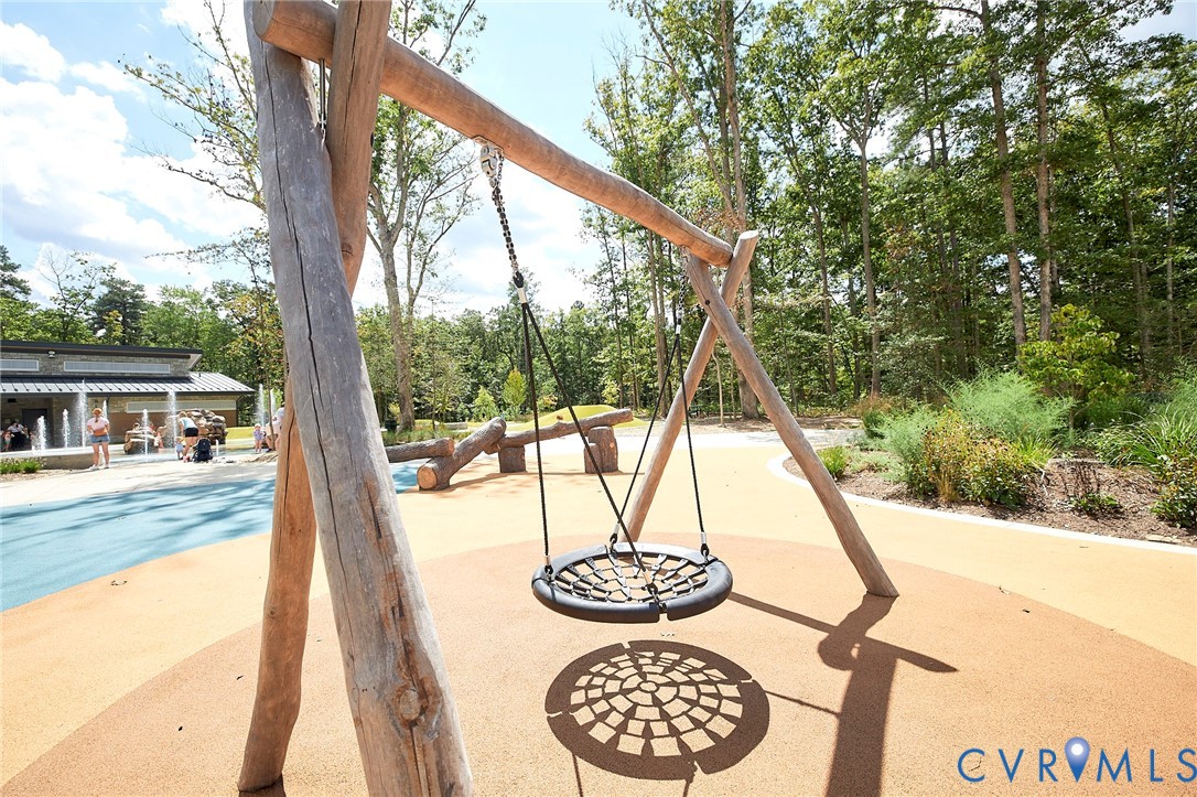 214 Greenpark Road Sandston, VA 23150 - Photo 38 of 50 View of play area featuring view of wooded area an