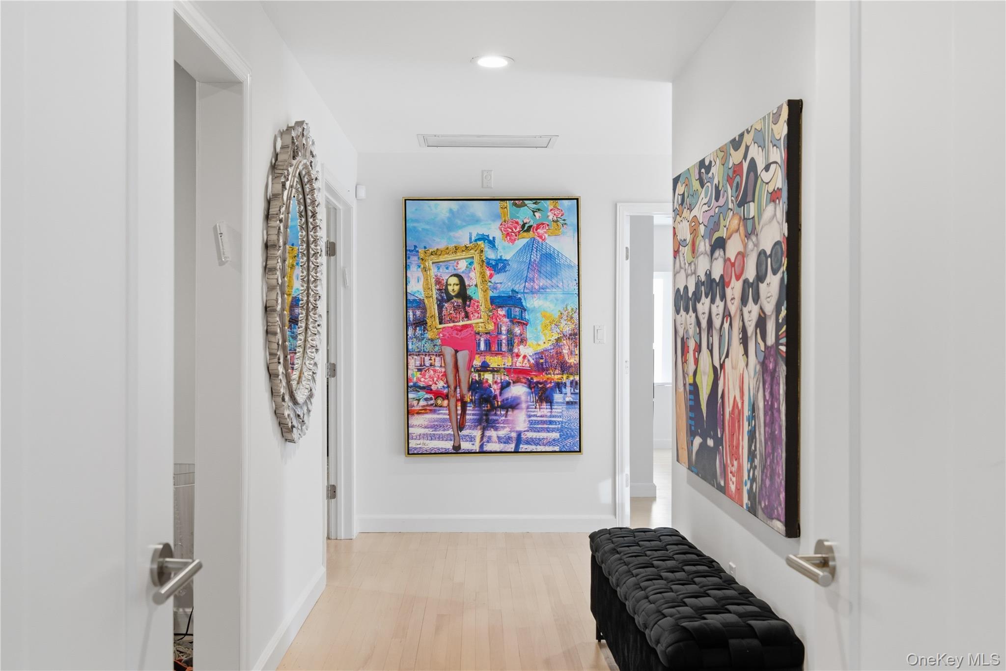 108 Bacon Road Old Westbury, NY 11568 - Photo 16 of 39 a view of a entryway with furniture and wall paintings