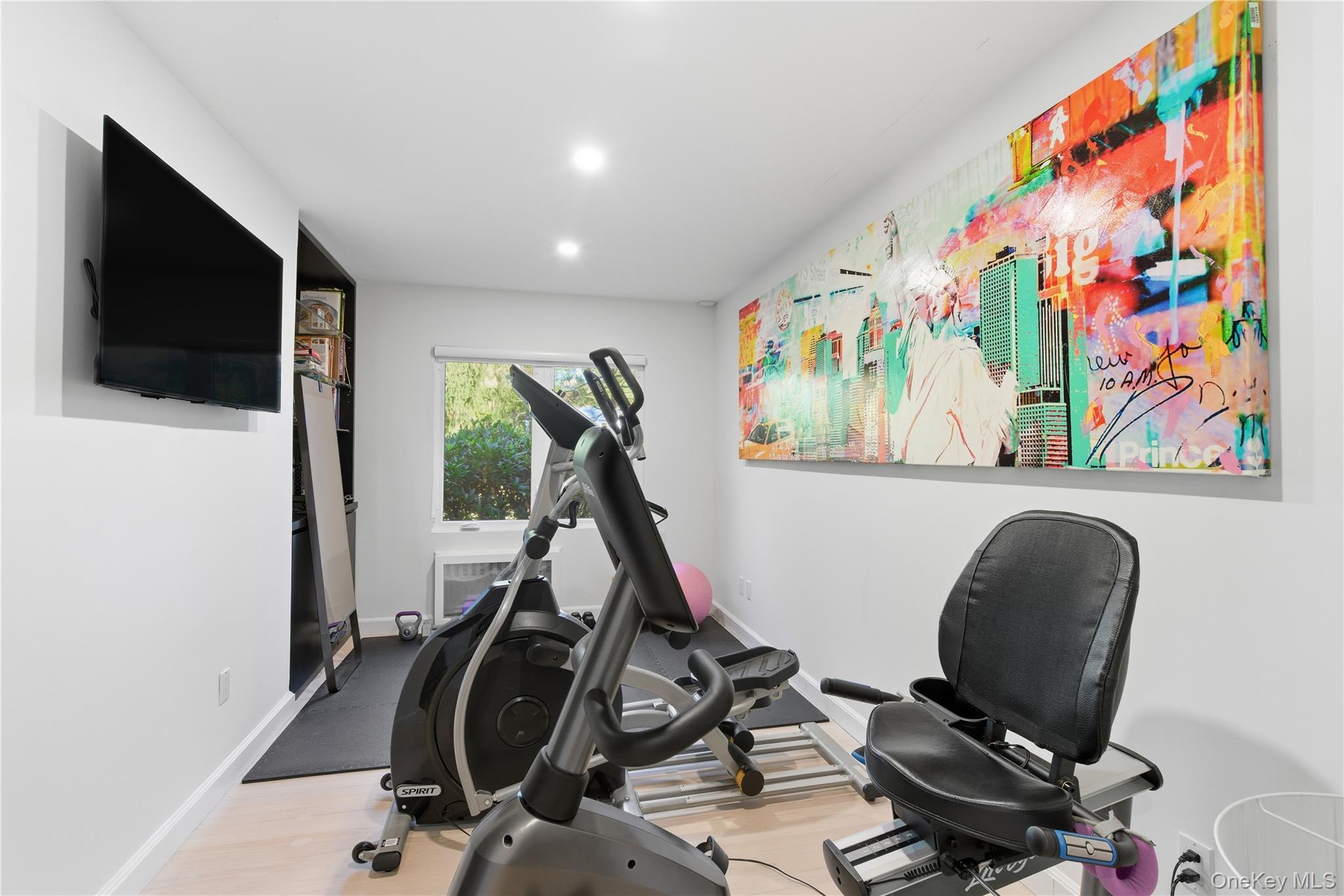 108 Bacon Road Old Westbury, NY 11568 - Photo 17 of 39 a view of a workspace with furniture and gym equipment