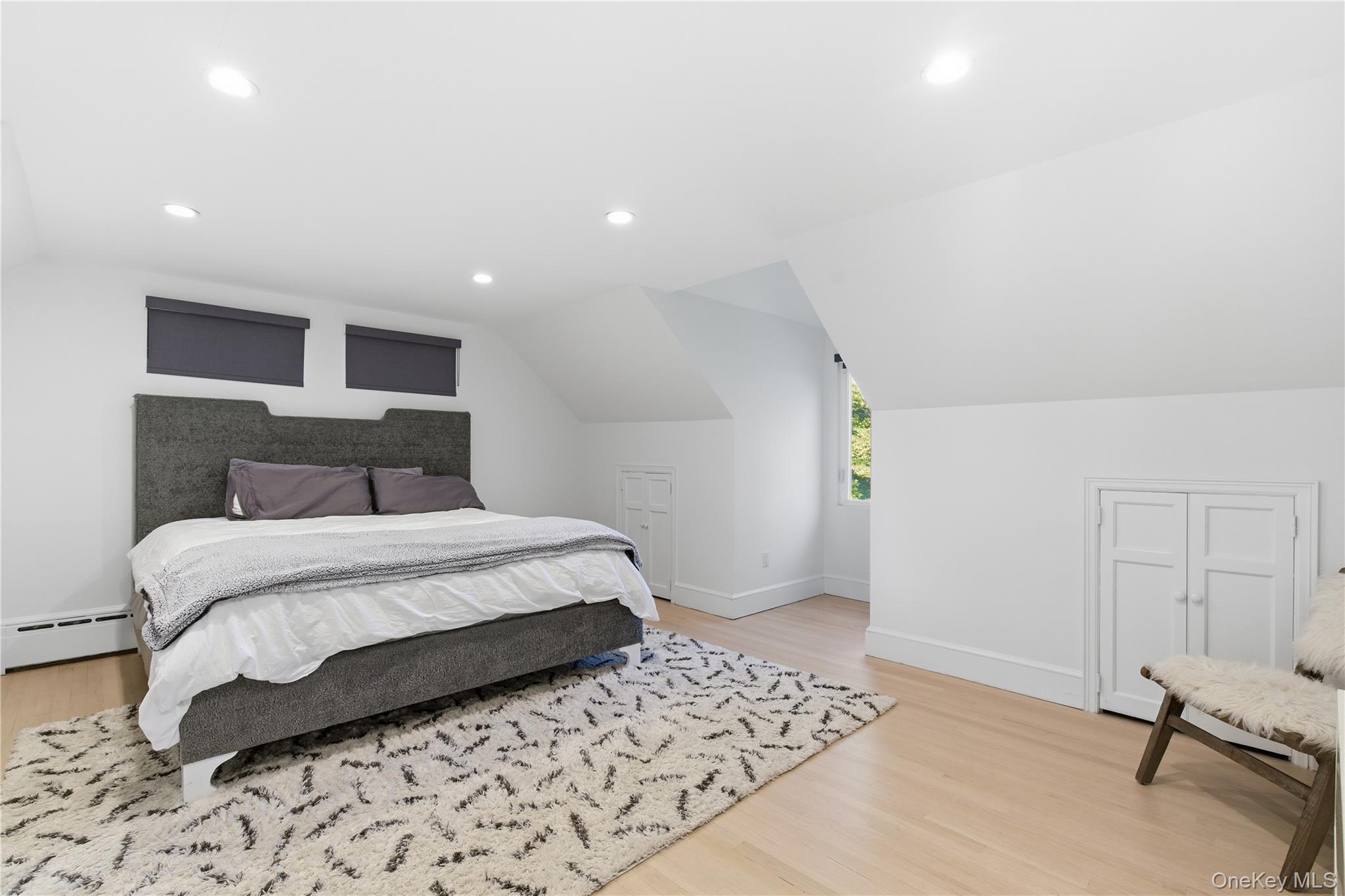 108 Bacon Road Old Westbury, NY 11568 - Photo 25 of 39 a bedroom with a bed and a window