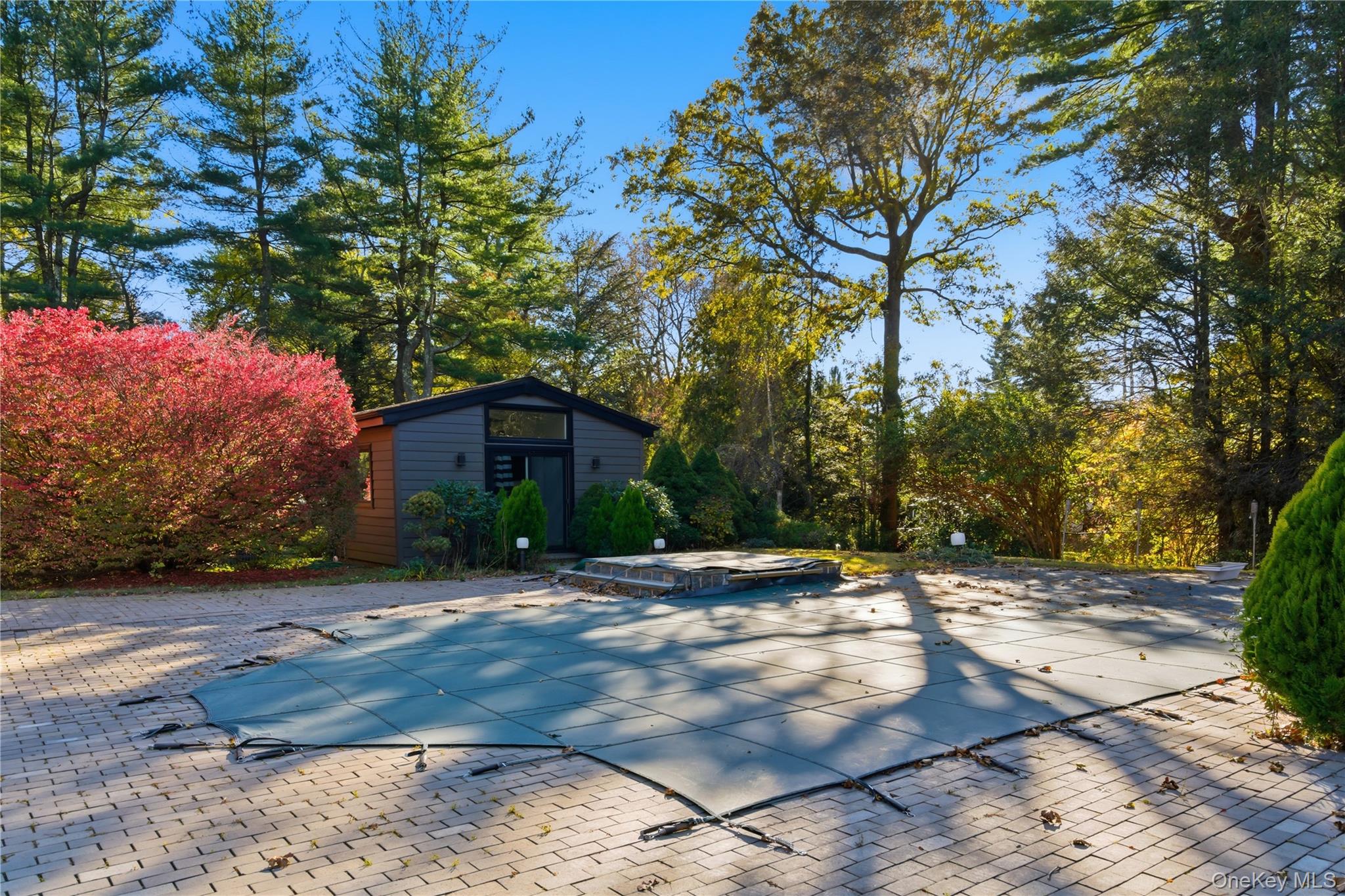108 Bacon Road Old Westbury, NY 11568 - Photo 30 of 39 a street view with large trees