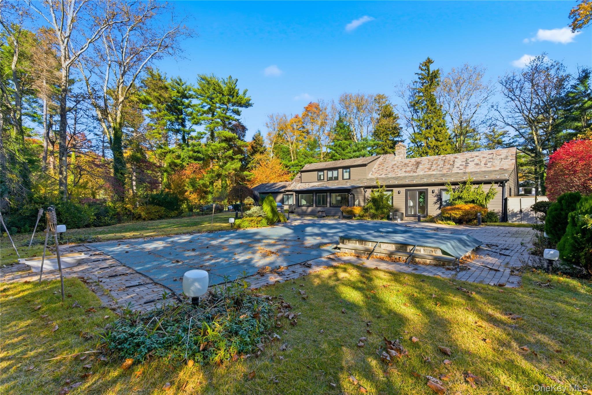 108 Bacon Road Old Westbury, NY 11568 - Photo 31 of 39 a view of a house with a yard