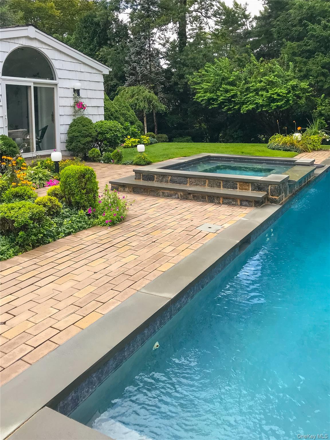 108 Bacon Road Old Westbury, NY 11568 - Photo 32 of 39 a view of a house with a yard