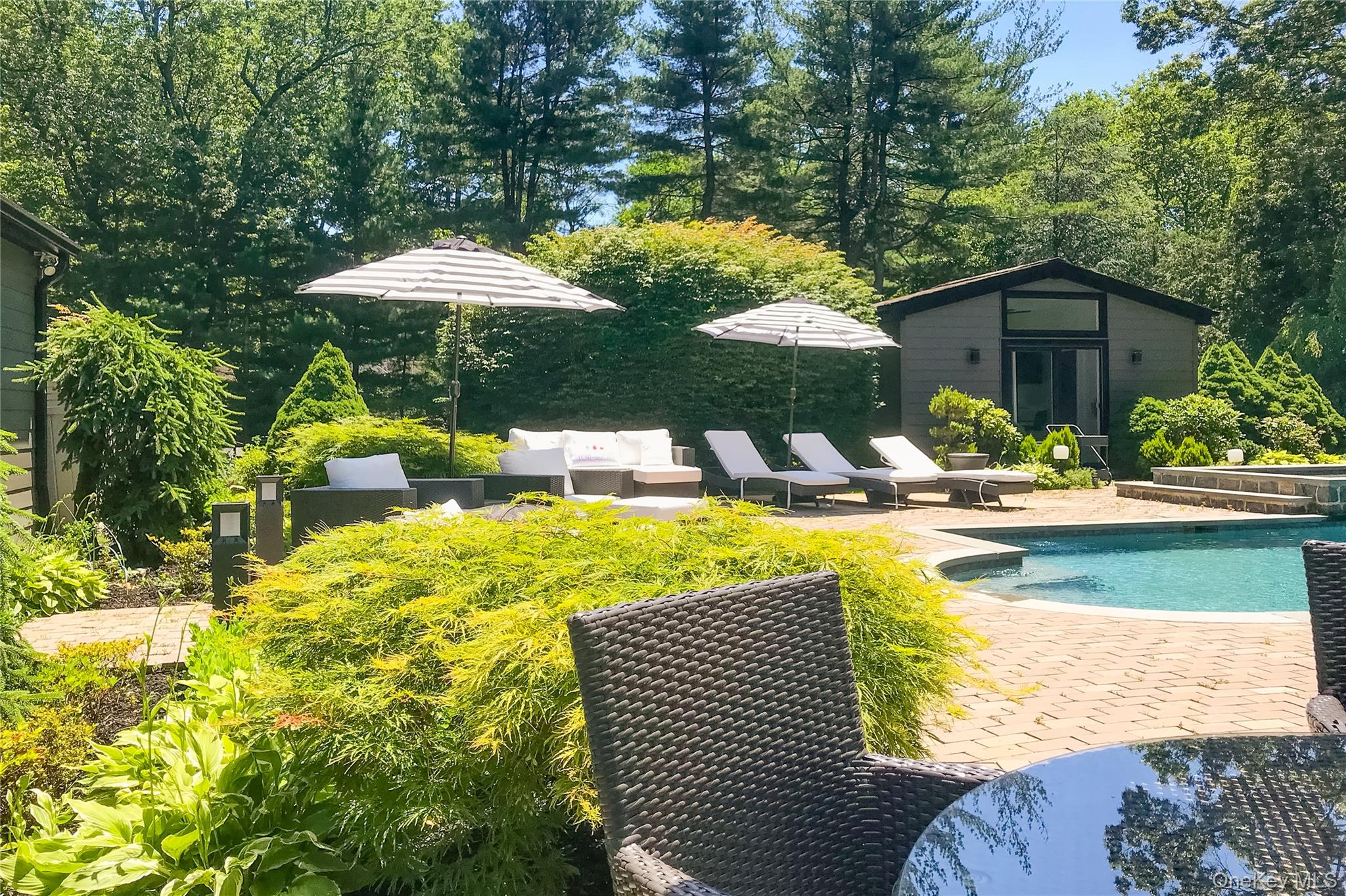 108 Bacon Road Old Westbury, NY 11568 - Photo 33 of 39 a view of swimming pool with a patio