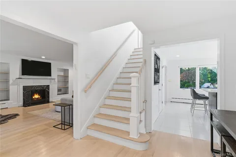 a view of a livingroom with furniture and a fireplace