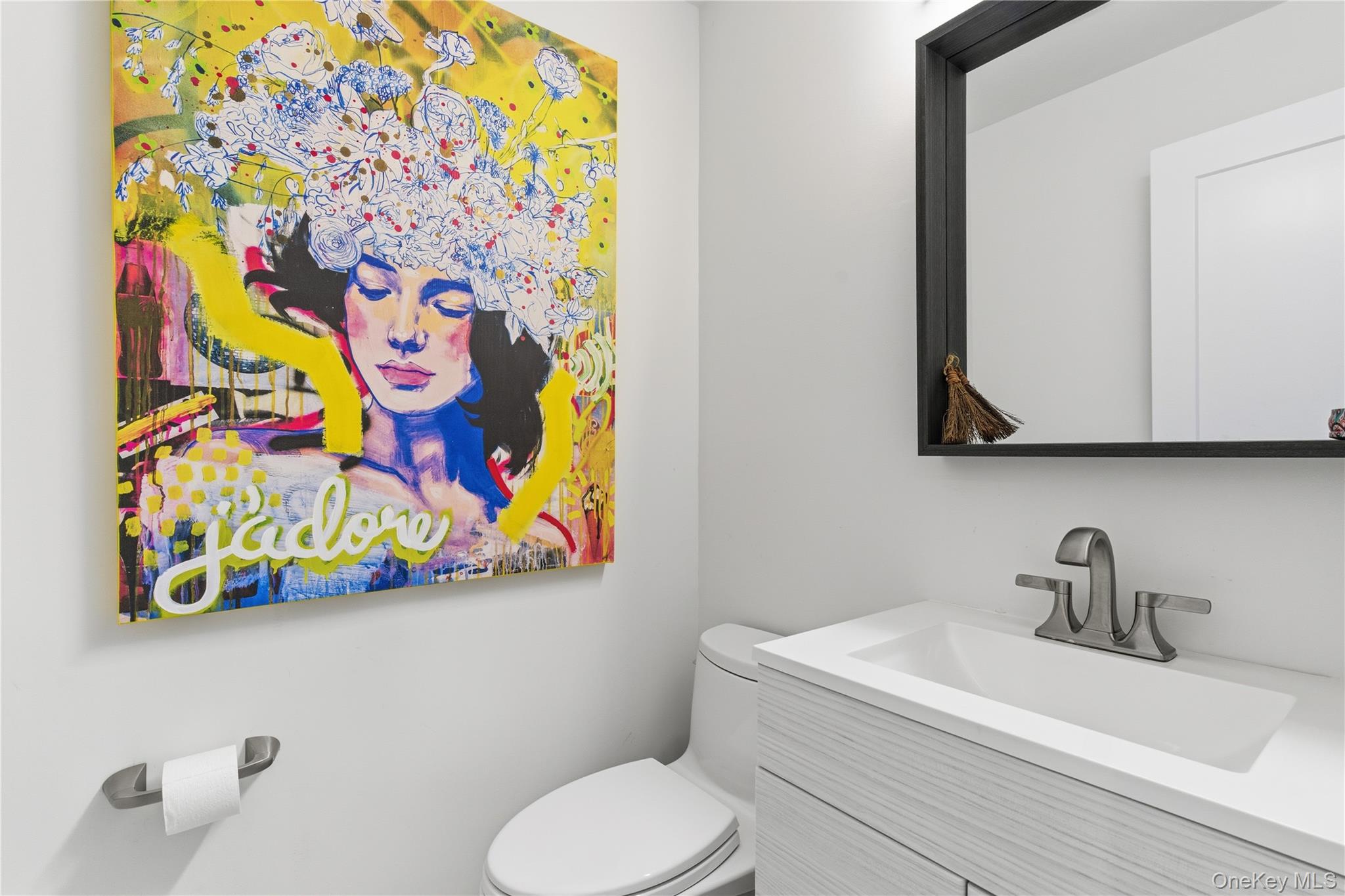 108 Bacon Road Old Westbury, NY 11568 - Photo 9 of 39 a bathroom with a toilet sink and mirror