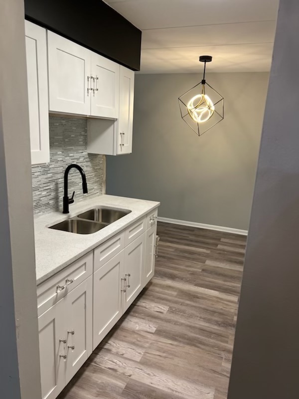 2345 185th Court, Unit 16 Lansing, IL 60438 - Photo 4 of 12 a bathroom with a sink a mirror and vanity