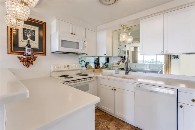 a view of a livingroom with furniture and a kitchen