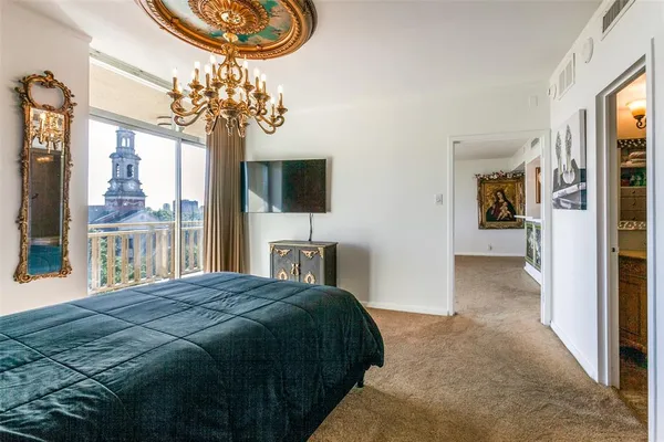 a spacious bedroom with a bed and a window