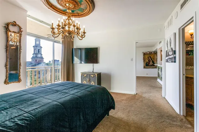 a spacious bedroom with a bed and a window