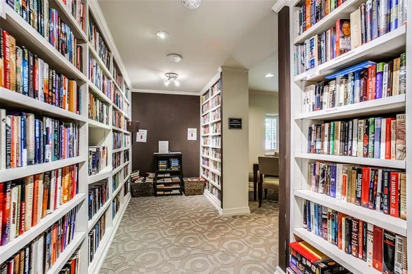 a living room with lots of books