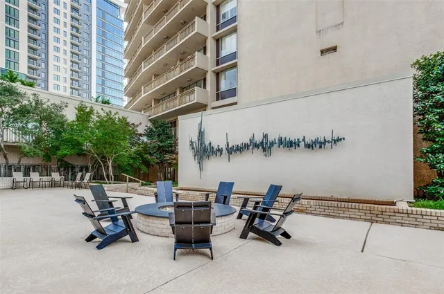 a view of a patio with a table and chairs