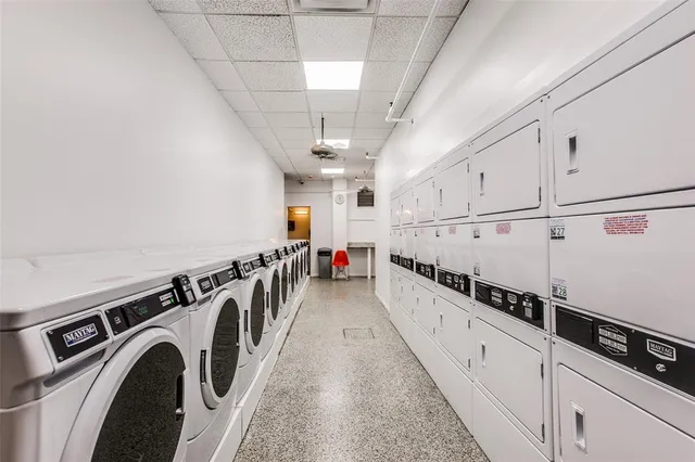 a view of a hallway with washer and dryer