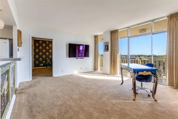 a view of an empty room with a window