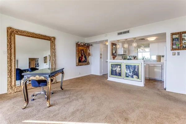 a view of a kitchen cabinets and a room
