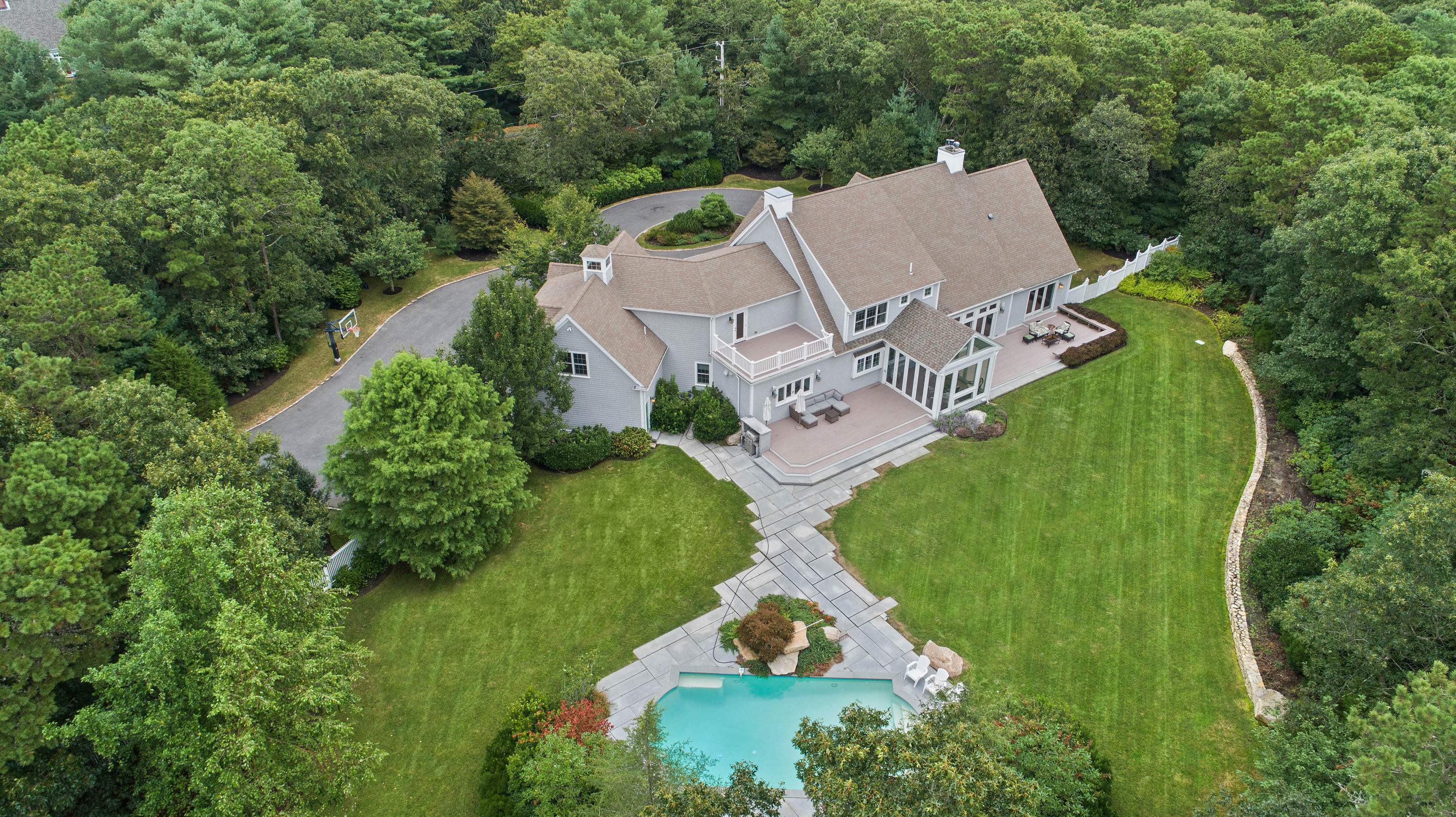 87 Seapuit Road Osterville, MA 02655 - Photo 39 of 39 an aerial view of a house with a garden and trees